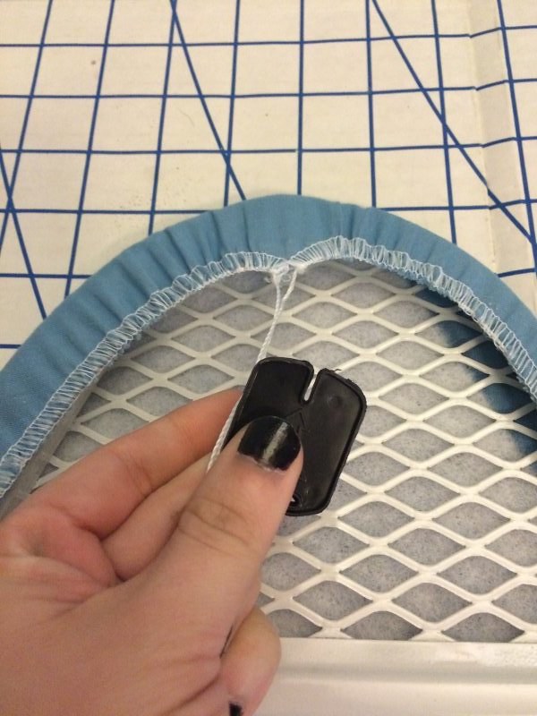 Plastic piece to tighten the drawstring. Set this aside for later.